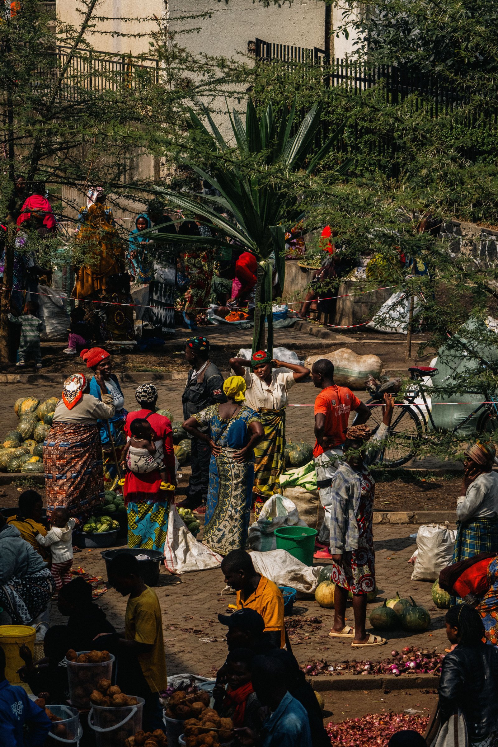 Bustling open-air market with traders and fresh produce